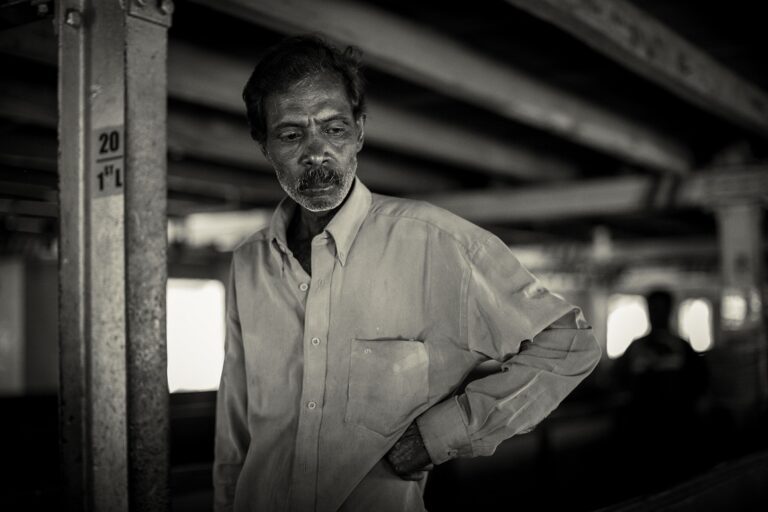 Adult Indian man. Portrait of pensive poor Indian man. Black and white photo. Soft focus