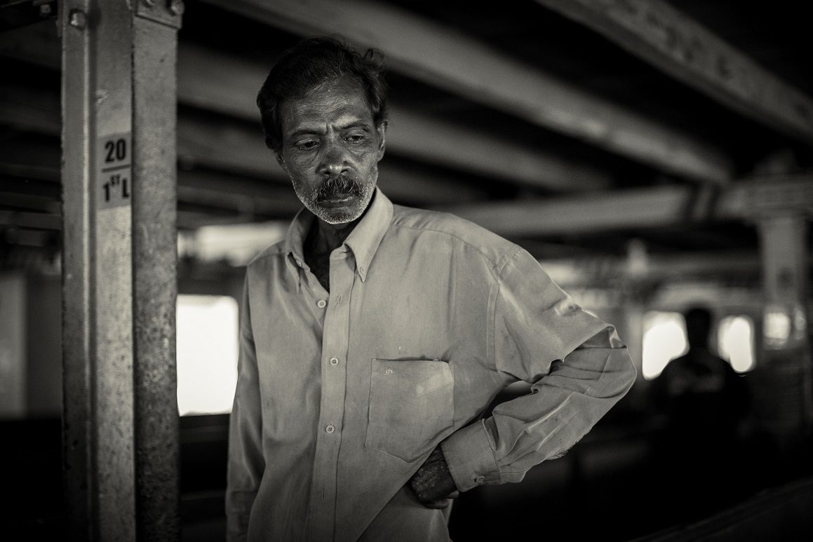 Adult Indian man.  Portrait of pensive poor Indian man. Black and white photo.  Soft focus